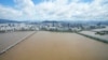 The Han River, swollen with floodwater, flows under bridges in Seoul, South Korea, Sept. 6, 2022. 