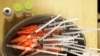 FILE - Syringes with COVID-19 vaccine are ready for use in New Orleans, Jan. 25, 2022. The CDC said Aug. 23, 2023, that the new BA.2.86 lineage of coronavirus may be more capable than older variants at infecting those who previously were infected or vaccinated.
