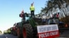 Polish farmers block the A2 motorway as they stand atop a tractor, to protest over price pressures, taxes and against the import of agricultural products from Ukraine, close to the Polish-German border, Feb. 25, 2024. 