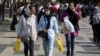 Women shop in the old main bazaar of Tehran, Iran, Oct. 1, 2022. All women in Iran must wear a veil while in public.