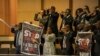People protest against the conflict in eastern Democratic Republic of Congo during the opening ceremony of the 37th Ordinary Session of the Assembly of the African Union at the AU headquarters in Addis Ababa, Ethiopia, on Feb. 17, 2024.