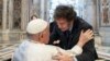 This handout photograph taken on Feb. 11, 2024 and released by the Vatican press office, Vatican Media, shows Pope Francis (L) greeting Argentine President Javier Milei (R) at the Vatican. (Photo by Handout / Vatican Media / AFP)