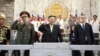 FILE - North Korea's Kim Jong Un, center, Russian Defense Minister Sergei Shoigu, left, and Chinese Communist Party politburo member Li Hongzhon attend a military parade to mark the 70th anniversary of the Korean War armistice, in Pyongyang, North Korea, July 27, 2023.
