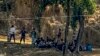 Polisi Perbatasan Myanmar yang mengenakan baju preman beristirahat setelah melarikan diri menyusul serangan oleh tentara etnis Arakan, sementara tentara perbatasan Bangladesh bersiaga di Ghumdhum, Bandarban, Bangladesh, 5 Februari 2024. (Foto: Shafiqur Rahman/AP Photo) 