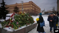 People remember Alexei Navalny where the first camp of the Gulag political prison system was established in Moscow, Russia, Feb. 17, 2024. 