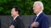 President Joe Biden and South Korea's President Yoon Suk Yeol pause after laying a wreath as they visit the Korean War Veterans Memorial in Washington, April 25, 2023.
