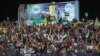Supporters cheer during the final match of a football tournament at the municipal stadium in Syria's rebel-held city of Idlib, where football has become an escape valve amid years of conflict and misery, Aug. 18, 2023.
