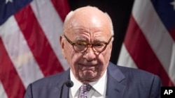 FILE - Rupert Murdoch introduces Secretary of State Mike Pompeo during the Herman Kahn Award Gala, Oct. 30, 2019, in New York. 