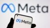 FILE - A smartphone with Meta logo is seen in front of displayed Facebook's new rebrand logo Meta in this illustration taken Oct. 28, 2021. 
