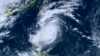 This satellite image provided by courtesy of the National Institute of Information and Communications Technology (NICT) shows Typhoon Saola moving north towards Taiwan, Aug. 29, 2023. 
