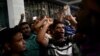 Supporters of Islamist leader Delwar Hossain Sayeedi chant slogans as they gather in front of a hospital, where he died following a heart attack, in Dhaka, Bangladesh, on Aug. 14, 2023. 