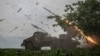 FILE - Ukrainian servicemen fire a BM-21 Grad multiple launch rocket system towards Russian troops near a front line, amid Russia's war on its neighbor, in Ukraine's Donetsk region, April 24, 2024.