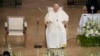 Pope Francis smiles as he arrives for a meeting with poor people and refugees in St. Elizabeth of Hungary Church in Budapest, Hungary, April 29, 2023.