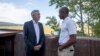 Federal Reserve Chairman Jerome Powell, left, chats with economist Philip Jefferson outside of Jackson Lake Lodge during the Jackson Hole Economic Symposium near Moran in Grand Teton National Park, Wyo., Aug. 25, 2023. 