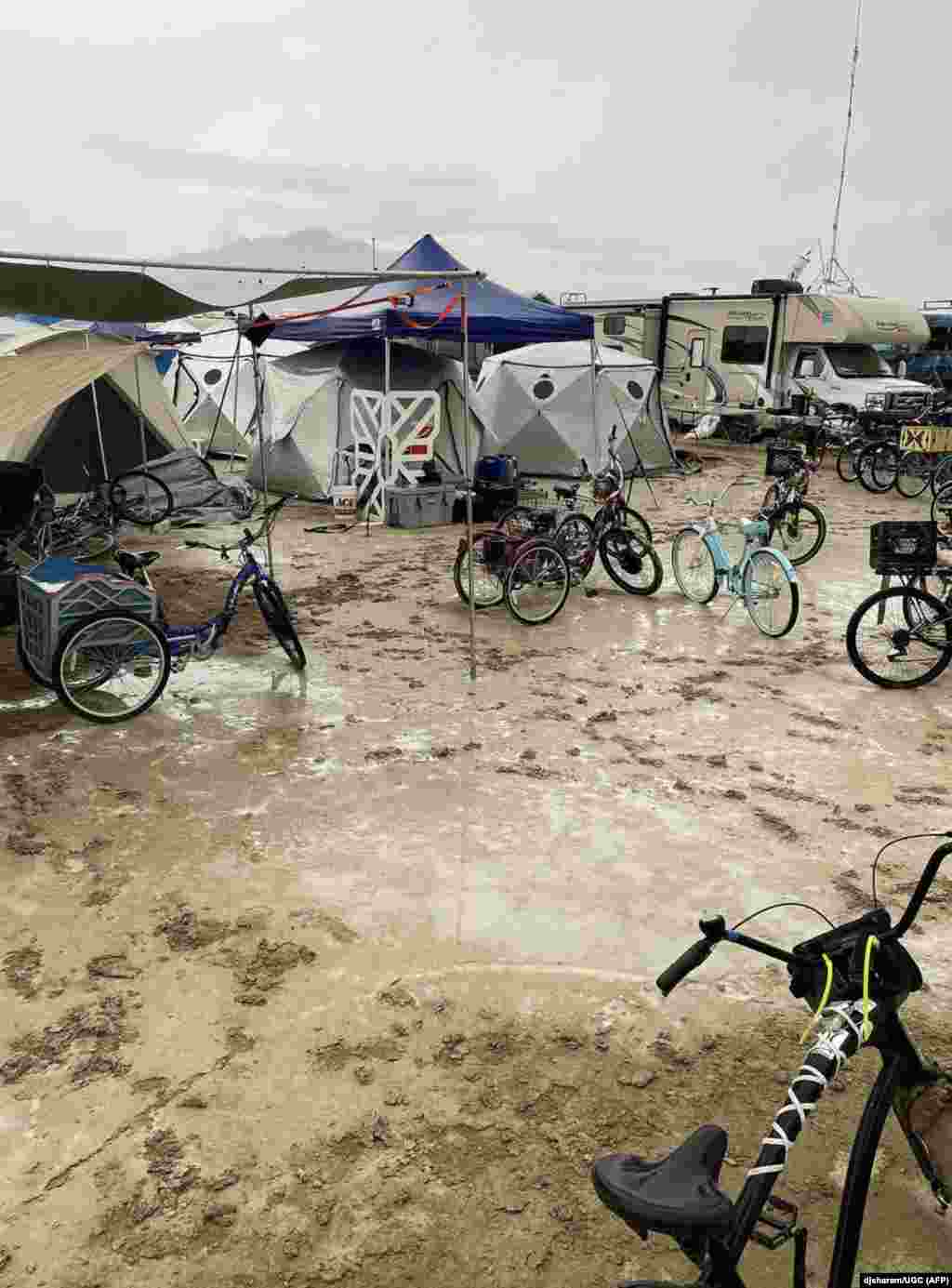 This handout provided courtesy of Instagram user djsharam, Sept. 3, 2023 shows bicycles sitting amongst flooding on a desert plain after heavy rains on Sept. 2, 2023, in Nevada's Black Rock desert. 