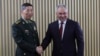 In this photo released by Russian Defense Ministry Press Service, Russian Defense Minister Sergei Shoigu, right, and Chinese Defense Minister Li Shangfu pose for a photo at the International Military Forum Army in Russia, Aug. 15, 2023.