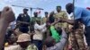 FILE - Mohamed Toumba, one of the soldiers who ousted Nigerian President Mohamed Bazoum, addresses supporters of Niger's ruling junta in Niamey on Aug. 6, 2023. The junta ordered its armed forces to go on highest alert on Aug. 25, 2023.