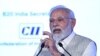 India's Prime Minister Narendra Modi addresses the gathering on the third day of the three-day B20 Summit in New Delhi on Aug. 27, 2023. 