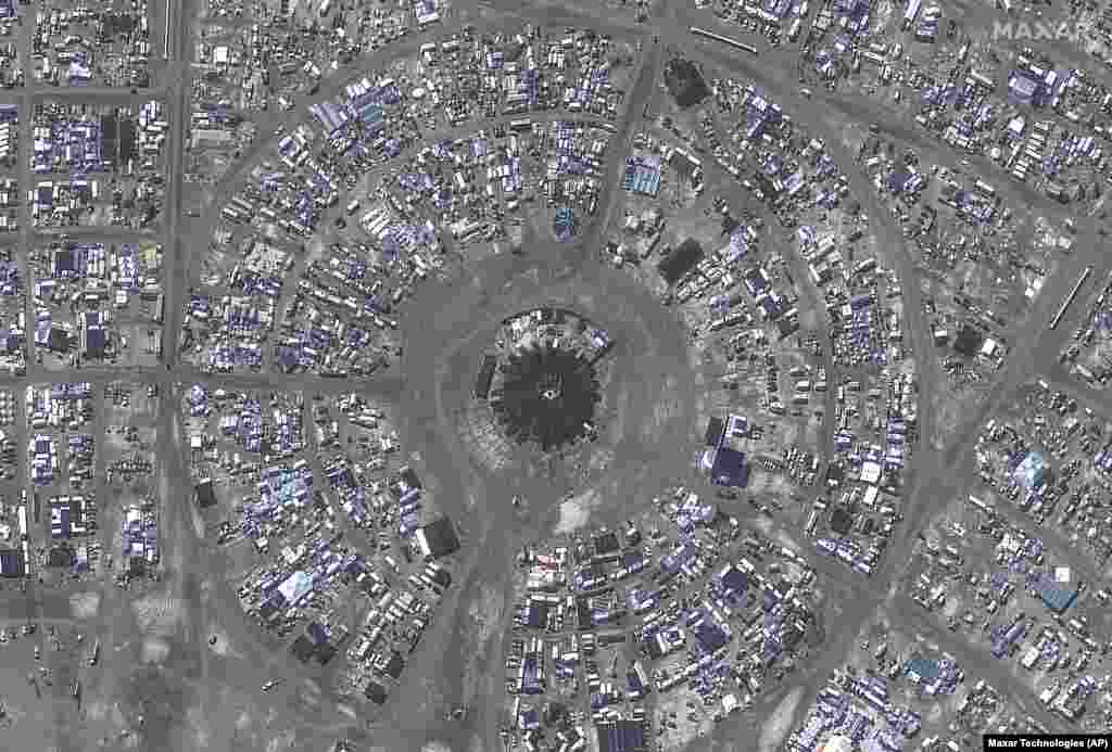 This photo, provided by Maxar Technologies, shows an overview of the center camp at the Burning Man festival, Sept. 4, 2023, in the Black Rock Desert north of Reno, Nevada.