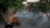 FILE: Seorang prajurit Ukraina dari unit pertahanan udara Brigade Mekanik ke-93 mengendarai pengangkut personel lapis baja (APC) dengan meriam anti-pesawat, di garis depan, dekat kota Bakhmut, Ukraina, 23 Mei 2024. (REUTERS/Oleksandr Ratushniak)