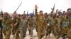 Panglima militer Sudan Jenderal Abdel-Fattah Burhan (tengah) mengunjungi Pangkalan Marinir Flamingo di Pelabuhan Sudan, Senin, 28 Agustus 2023. (Foto: AFP)