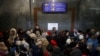 People fleeing stand in a crowded underpass at a train station to catch a train to Poland, in Lviv, Ukraine, Feb. 28, 2022. 