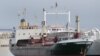 FILE - A ship believed to be carrying three containers of weapons is docked at a Lebanese navy base, in Beirut, Lebanon, April 28, 2012. The ship came from Libya via Egypt, and then to the port of the Lebanese north city of Tripoli on its way to Syria, according to Lebanon's state-run National News Agency. 