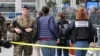 French police experts enter the cordoned off area after a knife attack at Gare de Lyon railway station, a major travel hub in Paris, on Feb. 3, 2024.