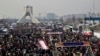 FILE -- Iranians attend an annual rally commemorating the anniversary of the 1979 Islamic revolution, on Azadi (Freedom) Street, while the Azadi tower is seen at rear left, in Tehran, Iran, Feb. 11, 2014. 