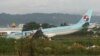 A damaged Korean Air plane lies after it overshot the runway at the Mactan-Cebu International Airport in Cebu, central Philippines early Oct. 24, 2022. The Korean Air plane overshot the runway while landing in bad weather in the central Philippines