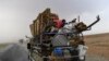 Displaced Syrians from Deir el-Zour head to refugee camps on the outskirts of Raqa on Sept. 24, 2017, as Syrian fighters backed by U.S. special forces battle to clear the last remaining Islamic State group jihadists holed up in their crumbling stronghold.