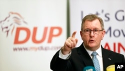 Democratic Unionist Party (DUP) leader Jeffrey Donaldson speaks to the media during a press conference at Hinch Distillery, Temple, Northern Ireland, Tuesday, Jan. 30, 2024. 