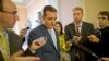 Senator Ted Cruz is pursued by reporters upon his return to Capitol Hill in Washington, Oct. 11, 2013.