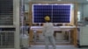 FILE - A worker conducts a quality check of a solar module at a factory in Xian, China, on Dec. 10, 2019. The European Union said on Jan. 24, 2024, that it wants to avoid over-reliance on China, which dominates in green technology production and other industries. 