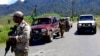 This handout picture released by the Royal Papua New Guinea Constabulary on Feb. 19, 2024, shows officials patrolling near the town of Wabag, 600 kilometres northwest of the capital Port Moresby.