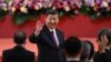 China's President Xi Jinping waves following his speech after a ceremony to inaugurate the city's new leader and government in Hong Kong on July 1, 2022, on the 25th anniversary of the city's handover from Britain to China.