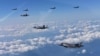 U.S. Marine Corps F-35B fighter jets (front) and South Korean air Force's F-15K fly over South Korea during a joint military drill, South Korea, Aug. 31, 2017.