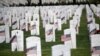 U.S. flags are seen at grave sites at Arlington National Cemetery in Arlington, Virginia, May 24, 2019, ahead of Memorial Day weekend.
