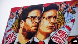 A banner for 'The Interview' appears outside a theater in the Hollywood section of Los Angeles, Dec. 17, 2014.