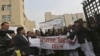 Protesters shout slogans as they hold placards and banners during a protest demanding the judicial system act faster against rape, outside a district court in New Delhi, India, January 3, 2013.