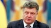 FILE - Ukrainian President Petro Poroshenko takes part in a meeting of the Security Council in Kyiv, June 16, 2014.