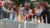 People light and place candles in memory of Ukrainian servicemen killed when their transport plane was downed by pro-Russian rebels in Luhannk region, in a central square of Ukraine's western city of Lviv, June 14, 2014.
