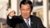 Cambodia's Prime Minister Hun Sen gestures as he arrives for a group photo of leaders at the 11th Asia-Europe Meeting (ASEM) in Ulaanbaatar, Mongolia, Saturday, July 16, 2016. (AP Photo/Mark Schiefelbein)