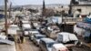 Civilians flee from Idlib toward the north to find safety inside Syria near the border with Turkey, Saturday, Feb. 15, 2020. Syrian troops are waging an offensive in the last rebel stronghold. (AP Photo)