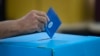 An Israeli man casts his vote during Israel's general elections in Tel Aviv, Israel, April 9, 2019.