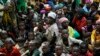 FILE - Refugees who fled Burundi's violence wait to board a U.N. ship, at Kagunga on Lake Tanganyika, Tanzania, to be taken to the port city of Kigoma, May 23, 2015. 