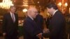FILE - In this photo released by Associated Press of Pakistan, Afghanistan Deputy Foreign Minister, Hekmat Khalil Karzai, right, shakes hands with Sartaj Aziz, adviser to the Pakistani prime minister on foreign affairs, prior to a meeting of delegates from Pakistan, Afghanistan, China and the United States, in Islamabad, Pakistan, Jan. 11, 2016. Richard Olson, U.S. Special Representative for Afghanistan and Pakistan is seen at left. 