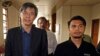 FILE - Malaysian opposition leader Tian Chua, left, and student activist Safwan Anang arrive at a court house in Kuala Lumpur, Malaysia, May 29, 2013. 