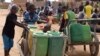 Displaced children that fled from their villages in northern Burkina Faso, following attacks by assailants, push carts loaded with water at a school in Ouagadougou, Burkina Faso, June 15, 2019. 