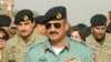 FILE - Major General Rizwan Akhtar arrives for a meeting, at the India-Pakistan Wagah Border Post, July 1, 2012.